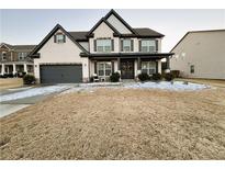 Two-story house with gray accents and a front yard at 5330 Austrian Pine Ct, Cumming, GA 30040