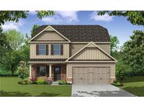 Two-story house with beige siding, stone accents, and a two-car garage at 48 Beaver Pt, Villa Rica, GA 30180