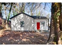 Newly renovated house with a red front door and white siding at 1273 Oakland Sw Ter, Atlanta, GA 30310