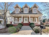 Two-story home with front porch and landscaped yard at 2165 Parkview Nw Run, Atlanta, GA 30318
