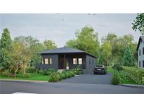 Modern dark-grey house with a landscaped lawn and driveway at 639 Ozburn, Atlanta, GA 30318