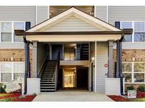 Apartment building entrance with stairs and covered walkway at 3102 Fairington Village Dr, Lithonia, GA 30038