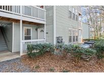 Exterior view of building, showing landscaping and individual unit entrance at 2042 Brian Way, Decatur, GA 30033