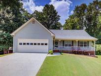 Ranch style home with front porch and attached garage at 399 Towler Dr, Loganville, GA 30052