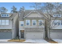Charming townhome showcasing a well-manicured lawn and neutral color scheme at 1766 Orange Grove Pl, Austell, GA 30106