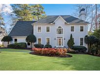 Two-story house with gray roof, white exterior, and landscaping at 60 Old Fuller Mill Ne Rd, Marietta, GA 30067