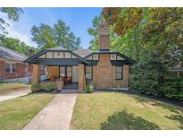 Brick home with a charming front porch and well-manicured lawn at 930 White St, Atlanta, GA 30310