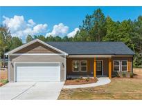 Charming home with a two-car garage and a well-manicured lawn under a bright blue sky at 121 Hunters Ln, Powder Springs, GA 30127