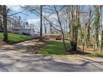 Cute ranch home with a spacious yard and mature trees at 3150 Halifax Dr, Cumming, GA 30041