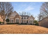 Brick house with a classic design, landscaped lawn, and a welcoming front porch at 2760 Veltre Sw Ter, Atlanta, GA 30311