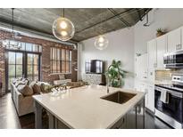 Modern kitchen with white cabinets, stainless steel appliances, and a large island at 3235 Roswell Ne Rd # 718, Atlanta, GA 30305
