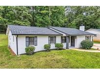 Newly renovated ranch home with green lawn at 2714 Preston Dr, Decatur, GA 30034