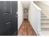 Inviting entryway featuring hardwood floors, stairs, and natural light at 915 Highwood Ln, Atlanta, GA 30344
