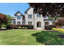 Beautiful home with a well-manicured lawn and a combination of painted and brick facade at 183 Applewood Ln, Acworth, GA 30101