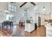 Bright, open-concept living room with high ceilings, modern lighting, and hardwood floors at 3204 Woodrow Ne Way, Atlanta, GA 30319