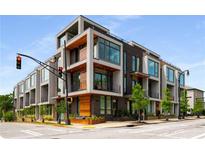 Contemporary three-story building with modern architectural design, and large windows, located on a corner lot at 105 Georgia Se Ave # 5, Atlanta, GA 30312