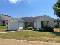 Ranch home with attached garage and small front yard at 416 Autumn Lake Ct, Mcdonough, GA 30253