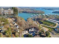 Aerial view of lakefront property with community and boat slips at 1709 Bald Ridge Marina Rd # 4, Cumming, GA 30041