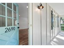 Inviting light blue front door opens to a hardwood floor interior at 2690 Old Hickory Nw Dr, Marietta, GA 30064