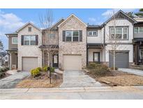 Attractive brick townhome with 2-car garage and landscaping at 2829 Ridgeview Sw Dr, Atlanta, GA 30331