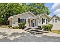 Charming ranch home with a spacious deck and well-manicured landscaping at 2192 Spink St, Atlanta, GA 30318