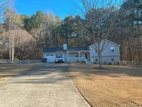 Ranch style home with attached garage and spacious yard at 2615 Azalea Dr, Loganville, GA 30052