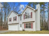 Two-story house with attached garage and red shutters at 6207 Willowbrook Dr, Riverdale, GA 30296