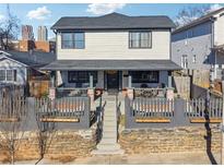 Two-story house with a front porch and a fenced yard at 230 Woodward Se Ave, Atlanta, GA 30312