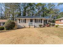 Charming ranch home with well-manicured lawn at 1255 Glen Forest Way, Decatur, GA 30032
