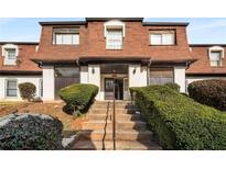 Attractive exterior of a two-story building with brick and shingle accents at 175 Rue Fontaine, Lithonia, GA 30038