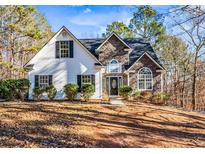 Two-story house with stone accents and landscaping at 4030 N Laurel Grove Rd, Douglasville, GA 30135