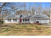 Charming one-story house with gray roof, white siding, and manicured lawn at 3781 Hickory Ridge Ct, Marietta, GA 30066