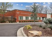 Brick building with landscaping and parking at 5200 Peachtree Rd # 1111, Atlanta, GA 30341