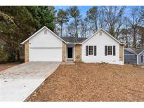 Charming ranch home with stone accents and a spacious driveway at 2966 Knollberry Ln, Decatur, GA 30034