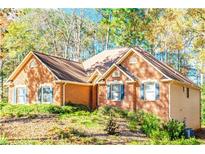 Brick house with a large yard and mature trees at 170 Amicalola Way, Jonesboro, GA 30236