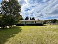 Ranch style home with large yard and mature trees at 5791 Warren Farm Sw Rd, Powder Springs, GA 30127