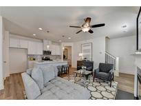 Open living room showcasing a cozy seating area and fireplace at 1591 Salem Dr # 76, Conyers, GA 30013