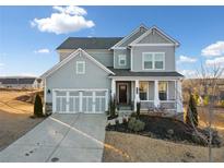 Two-story house with gray siding, three-car garage, and front porch at 4130 Grandview Vista St, Cumming, GA 30028