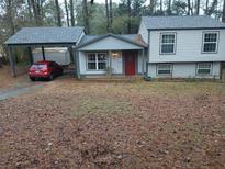 Ranch style home with carport and fenced yard at 3195 Newcastle Way, Snellville, GA 30039