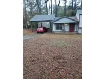 Ranch style home with carport and small front yard at 3195 Newcastle Way, Snellville, GA 30039