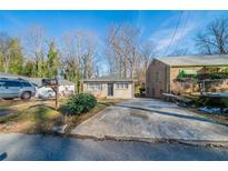 Cute Ranch home with a large driveway and well-maintained lawn at 491 Elbridge Nw Dr, Atlanta, GA 30318