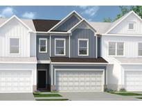 Two-story townhome with gray siding, brown roof, and two-car garage at 1180 Chastain Dr # 9, Sugar Hill, GA 30518