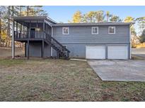 Ranch home with two-car garage and covered porch at 4074 Yeager Rd, Douglasville, GA 30135