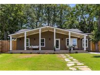 Ranch style home with covered porch and stone walkway at 1102 Fountain Sw Dr, Atlanta, GA 30314