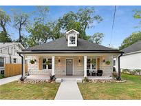 Charming craftsman style home with stone facade, front porch, and landscaped yard at 199 Racine Sw St, Atlanta, GA 30314