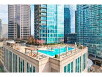 Luxury rooftop pool with city views and ample lounge space at 1080 Peachtree Ne St # 2716, Atlanta, GA 30309