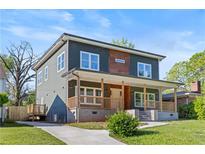Charming two-story home with a covered front porch and well-maintained lawn at 1432 Mims Sw St, Atlanta, GA 30314