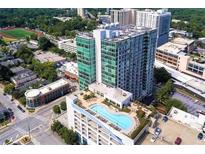 Aerial view of a modern high-rise building with a rooftop pool at 250 Pharr Ne Rd # 507, Atlanta, GA 30305