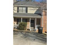 Two-story townhome with front porch, and small yard at 308 Flagstone Way # 308, Austell, GA 30168