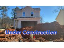 New construction home exterior; two-story, light beige, two-car garage at 1800 Forkview Ct, Lawrenceville, GA 30044